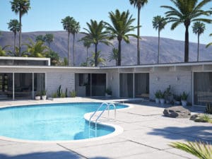 A pool with palm trees and a house in the background.