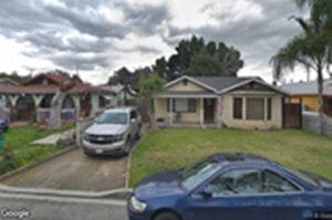 A car parked in front of a house.