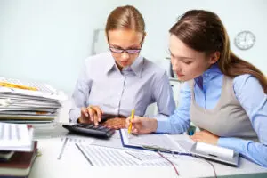 Two women are working on a project together.