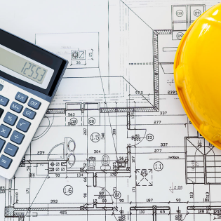 A calculator and hard hat sitting on top of a construction plan.