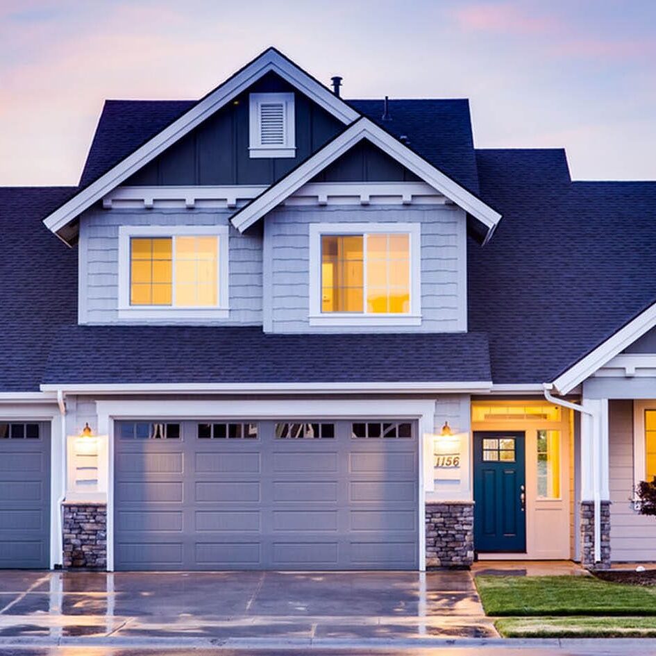 Modern suburban house with a double garage.
